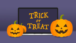 Trick or Treat on Laptop Screen with Pumpkins